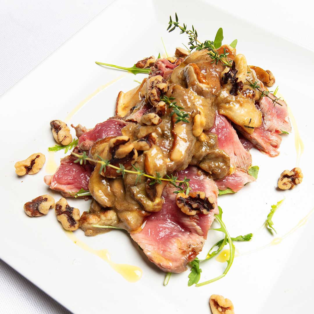 tagliata di manzo con porcini e noci tagliata di manzo con porcini e noci