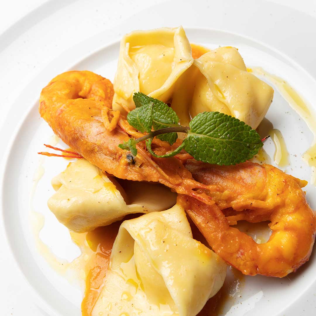 tortelli di ricotta su crema di zucca, gamberi e liquirizia tortelli di ricotta su crema di zucca, gamberi e liquirizia